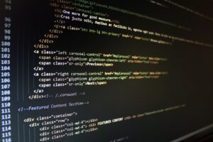 Close-up of HTML code displayed on a computer monitor, showcasing web development.